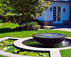 sleek round fountain in a home garden