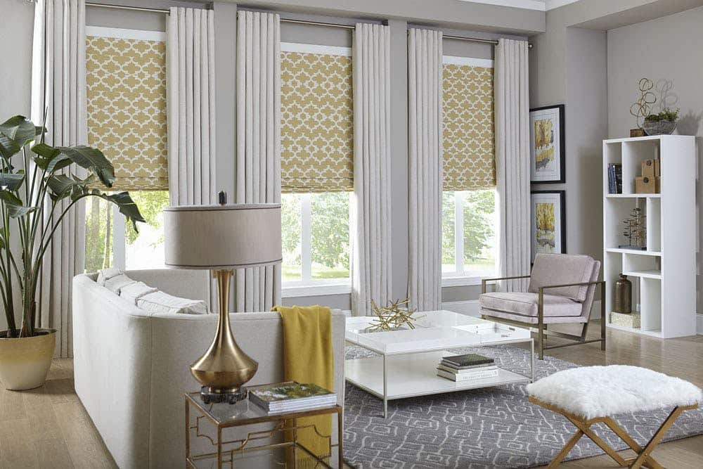 Curtains on top of Chick-Blinds on 3 large Windows in a living room