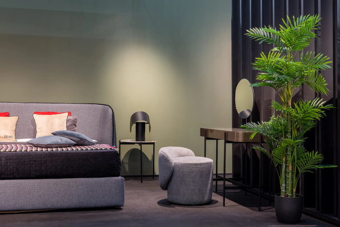 Contemporary Modern dark dressing table besides a bed